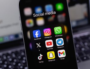 Social media app icons on a smartphone screen