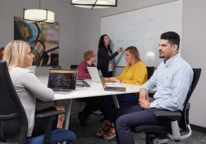 Ironmark employees in a conference room