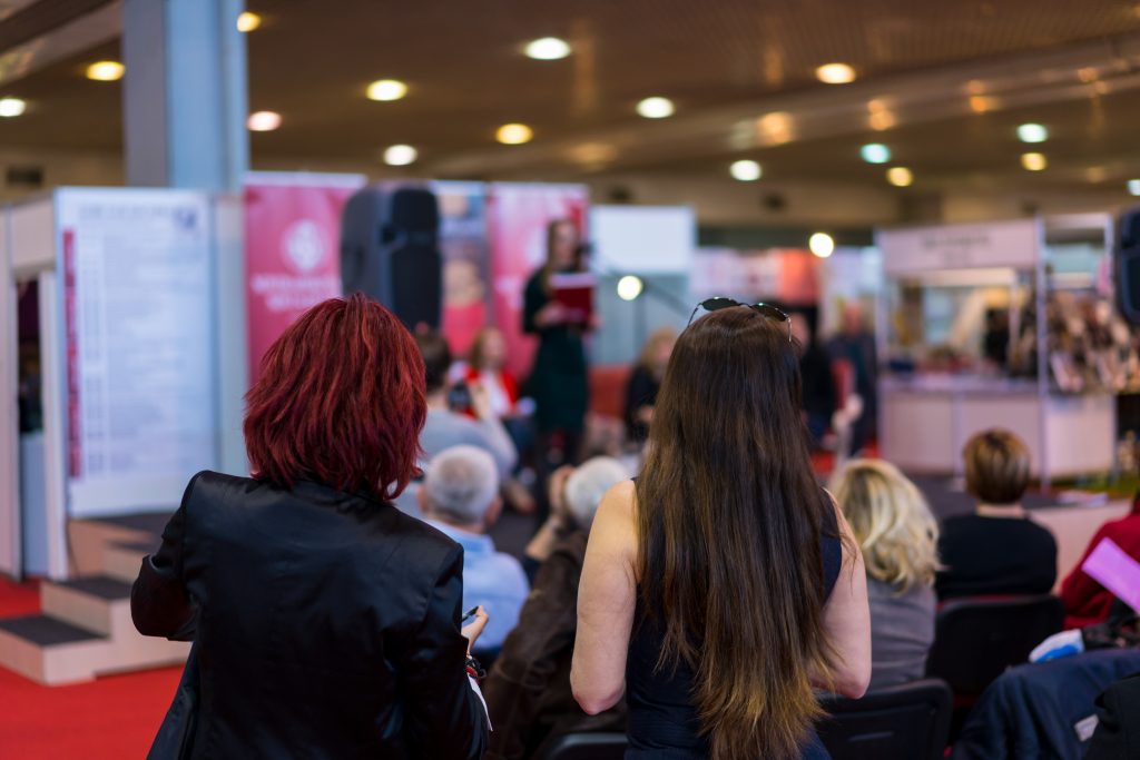 Two people attending a trade show