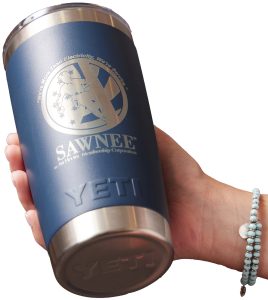 A hand holding customized drinkware