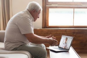 A man having a telehealth conference