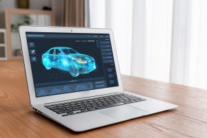 A computer animated car on a laptop screen